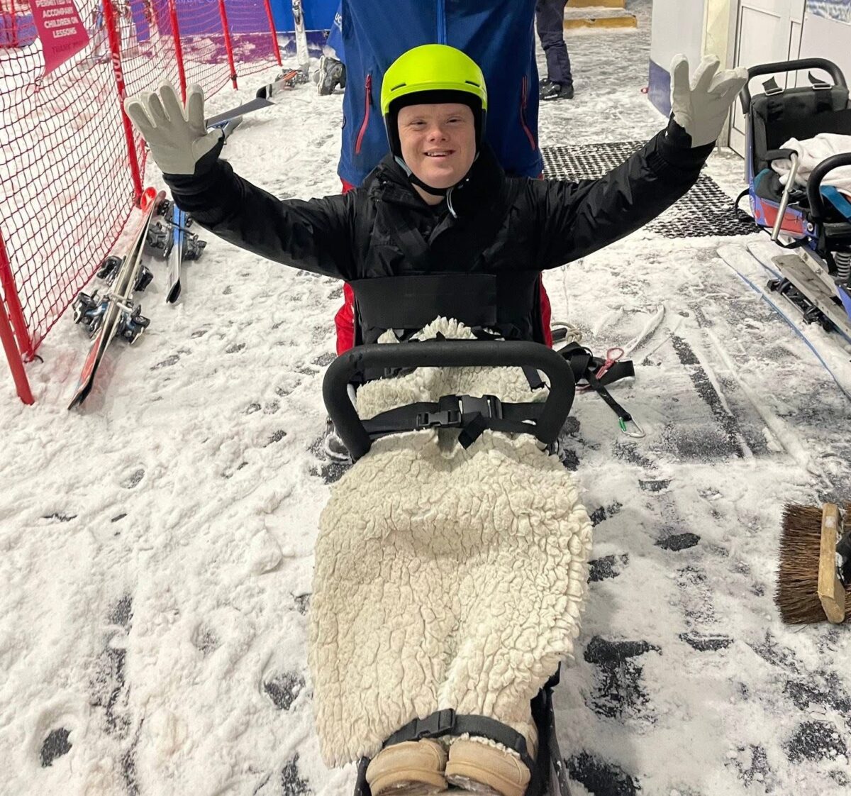 Boy enjoys an inclusive Ski Day at The Snow Centre in a sit-ski